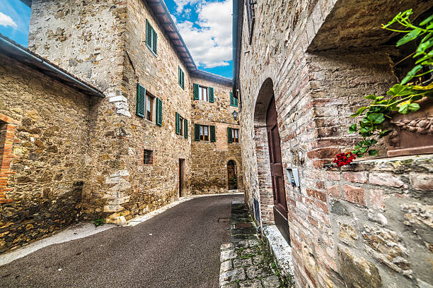 narrow alley in San Quirico d'Orcia, Italy