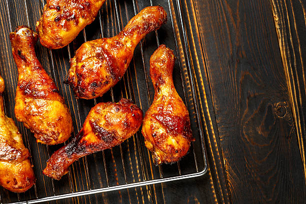 istock Grilled chicken legs on the grill 615831404