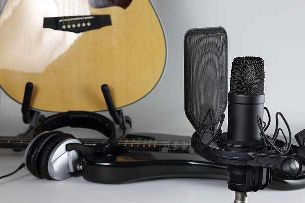 istock The studio microphone against the background of musical instruments 615831836