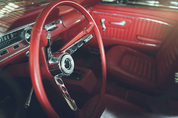 istock Close up on steering wheel, Classic car interior 615832536