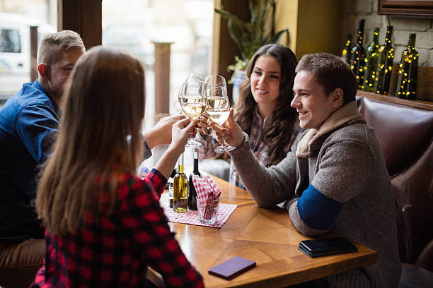 istock Group of friends toasting with white wine 615834092