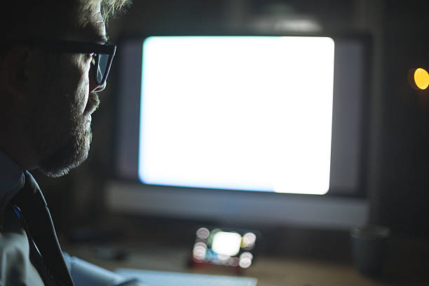 istock Man in front of computer monitor, working 615834672