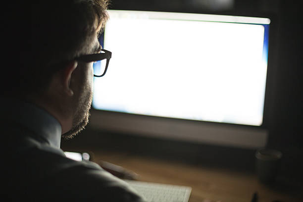 Man looking at computer monitor