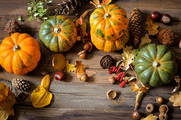 istock Decorative pumpkins on a wooden background 615835246