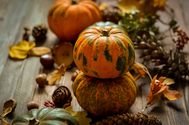 istock Decorative pumpkins on a wooden background 615835376