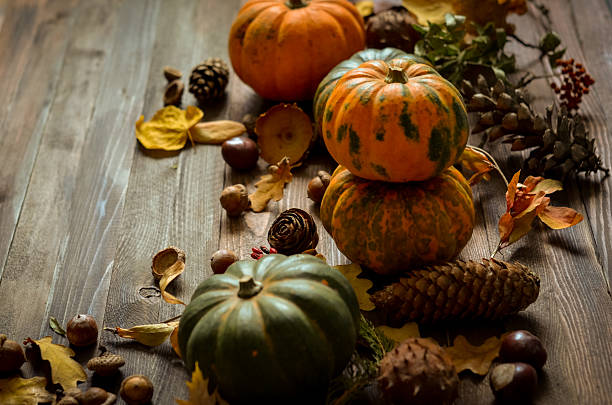 istock Decorative pumpkins on a wooden background 615835696