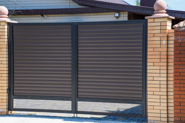 istock Gates of brown metal sheets. Roofing materials. 615835722