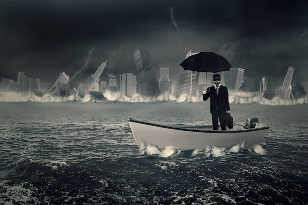 istock Businessman with umbrella in boat 615836752