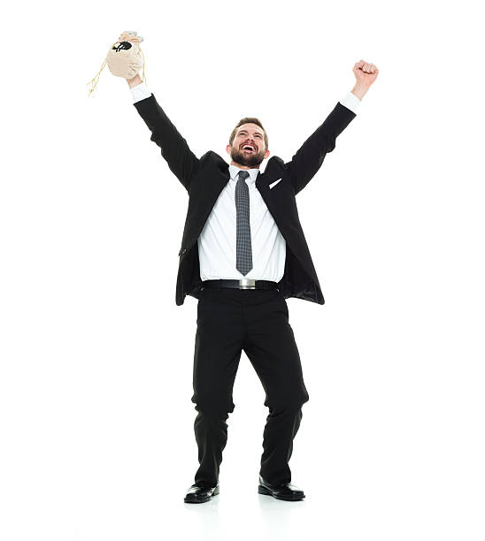 istock Smiling businessman cheering with money bag 615837050