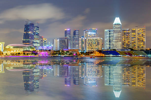 Reflection Building in Singapore Reflection Building in Singapore at night view of Marina Bay lee kuan yew stock pictures, royalty-free photos & images