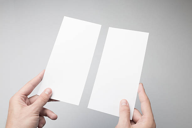 istock Hand holding Blank DL Flyer / Invitation Mock-up. 615838492