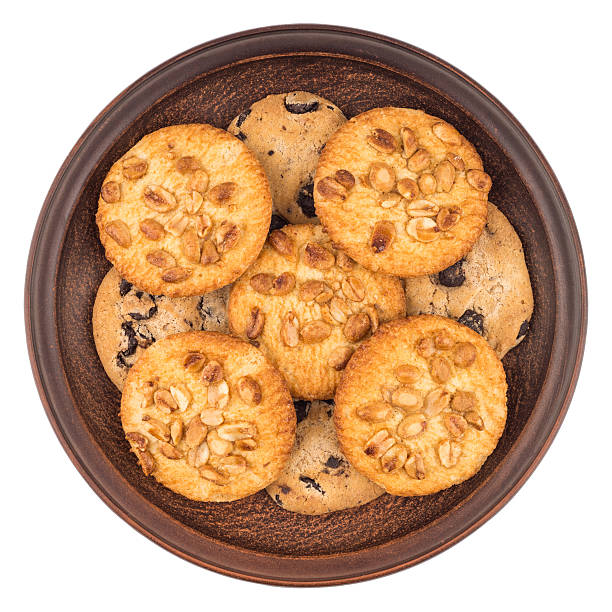 istock Cookies with peanuts and chocolate in a brown plate. 615840680