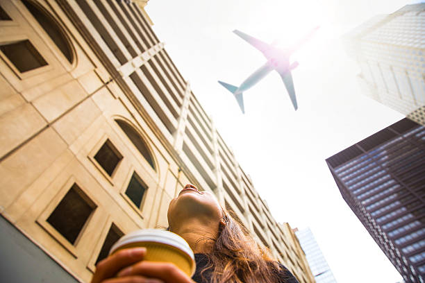 istock Woman looking up in Chicago downtown 615841070