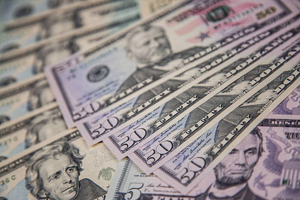 istock USA Currency - Multiple 50 Dollar banknotes 615881736