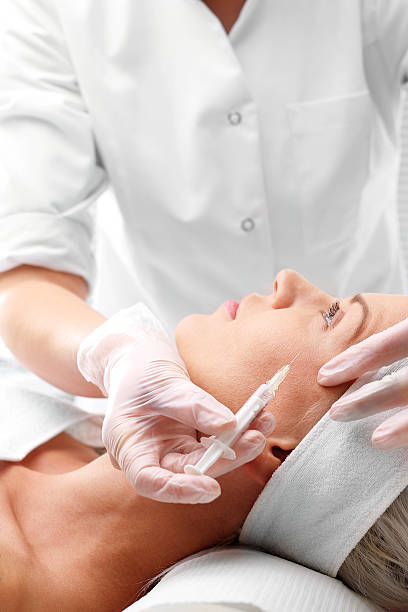 istock Injection of botox. 615881794