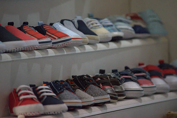 istock Children's shoes on a shelf 615883408