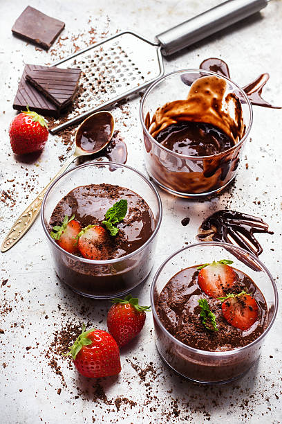 istock Chocolate mousse with strawberries in glass on rustic table 615883450