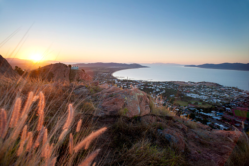 Sunset view of Townsville, Queensland, Australia looking from Castle Hill towards the coast and calm sea