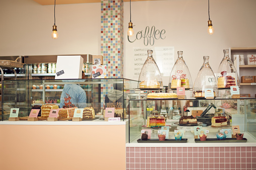 Shot of a young woman working in her bakery