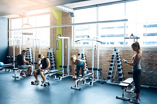 Shot of a group of people working out in the gym
