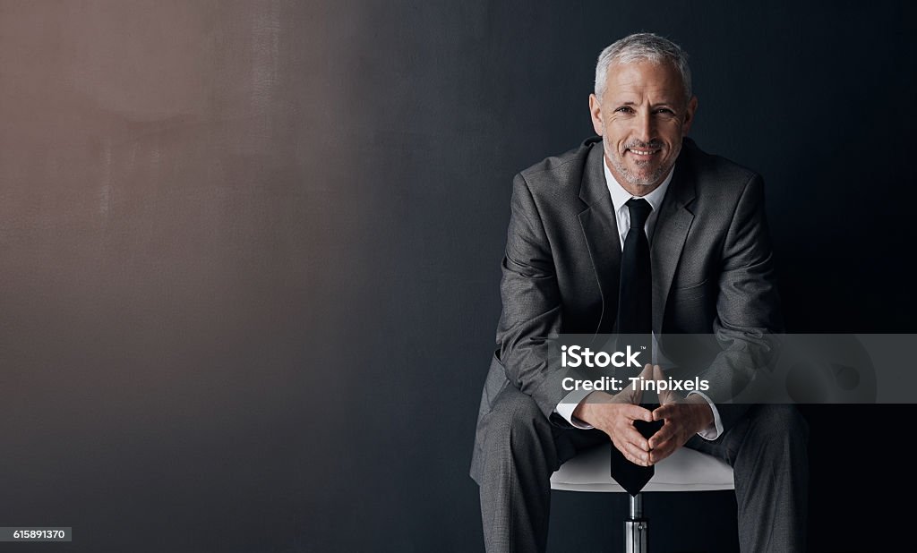 I’ve got complete assurance in my competence as a CEO Studio portrait of a mature businessman against a dark background 30-39 Years Stock Photo