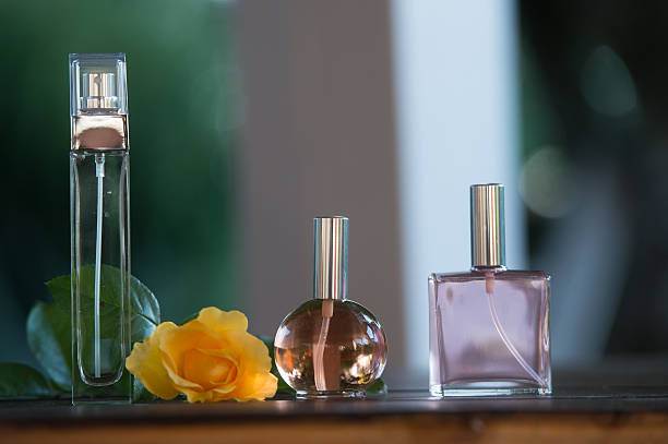istock Luxurious Perfume bottles on table outdoor 615892264