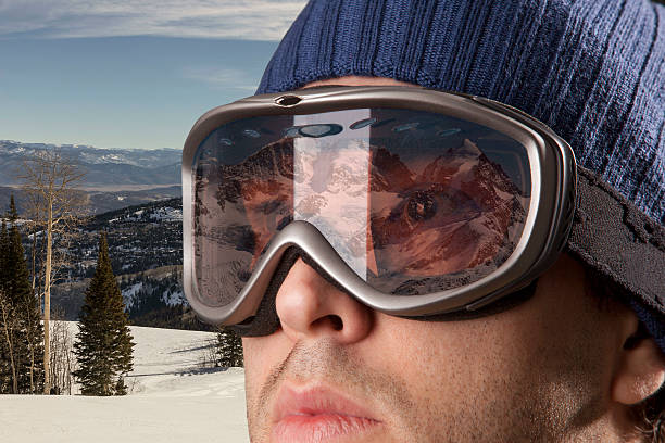 istock skier looking for a snowy mountain. 615892674