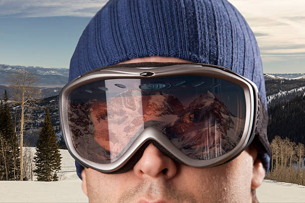 istock skier looking for a snowy mountain. 615893838