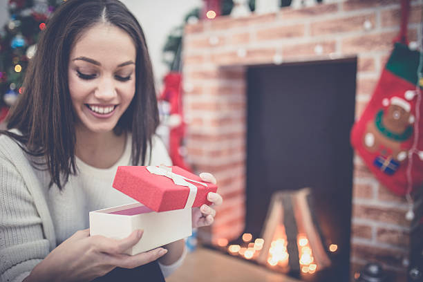 istock Woman with a Christmas Gift 615894306