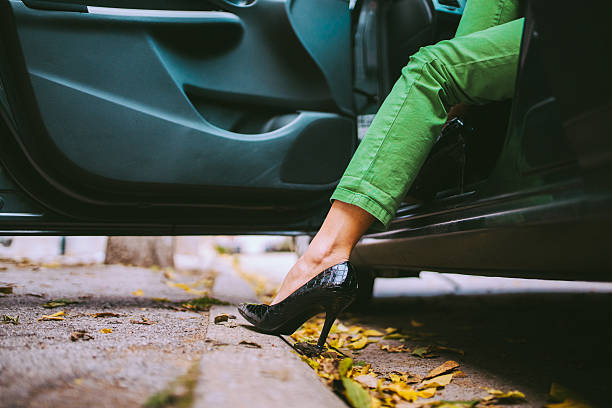 Getting out of the car Woman in high heels stepping out of the car woman legs open stock pictures, royalty-free photos & images