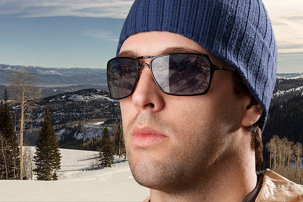 istock skier looking for a snowy mountain. 615895210