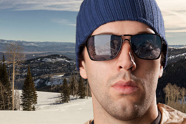 istock skier looking for a snowy mountain. 615896440