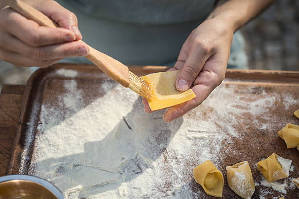 istock chef preparing handmade stuffed pasta tortellini 615897108