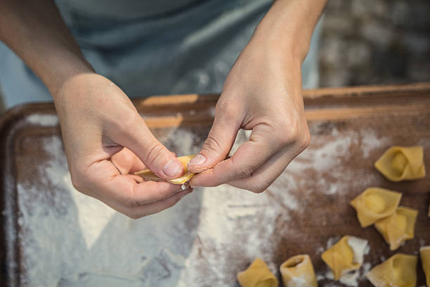 istock chef preparing handmade stuffed pasta tortellini 615897178