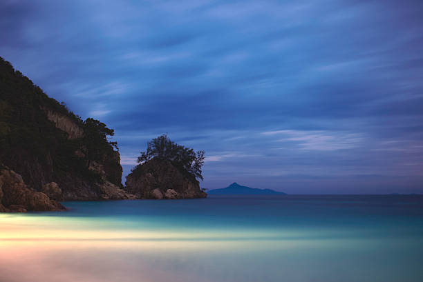 Evening on the beach Evening view of the ocean from a tropical island rawa island stock pictures, royalty-free photos & images