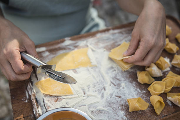 istock chef preparing handmade stuffed pasta tortellini 615897308
