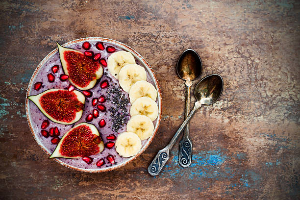 Fall and winter breakfast acai superfoods smoothies bowl. Copy space