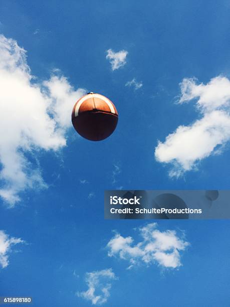 Football In Sky Stock Photo - Download Image Now - American Football - Ball, American Football - Sport, Throwing