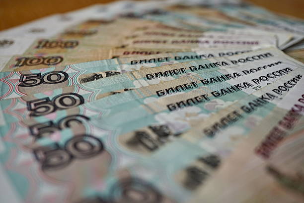 istock bank notes in value of hundred Russian Rubles (RUB) 615898526