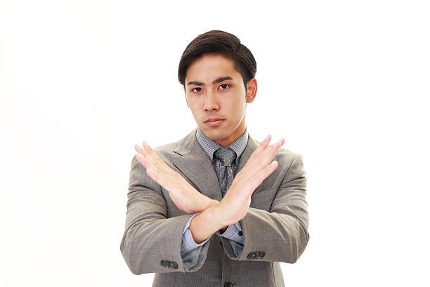 istock Man shows the sign of prohibition 615898546