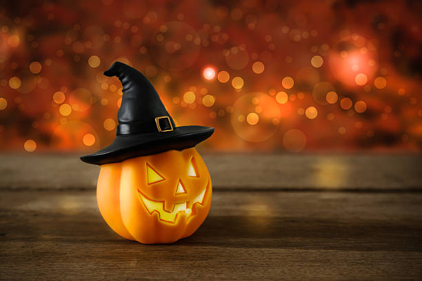 istock Halloween pumpkin head jack lantern on wooden background 615898674