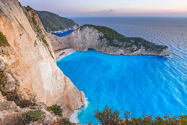 istock Navagio Beach (Shipwreck beach) at sunset on Zakynthos Island, Greece 615899134