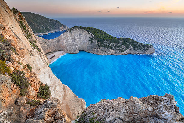 istock Navagio Beach (Shipwreck beach) at sunset on Zakynthos Island, Greece 615899302