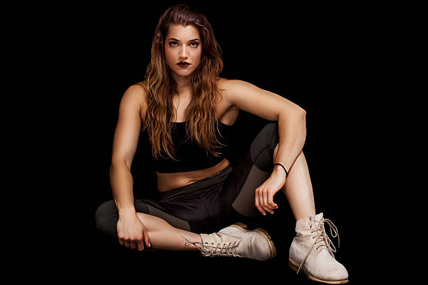istock Beautiful female bodybuilder portrait sitting and posing 615901520