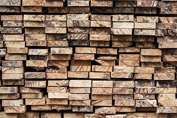 Photo of Pile of stacked rough cut lumber