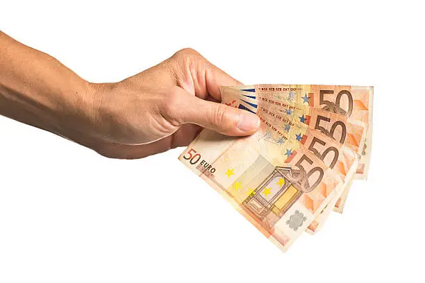 A hand holding several European currency, 50 Euros. Isolated on a white background. Photographed in studio in horizontal format.