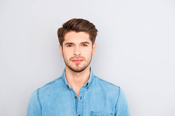 istock handsome young successful businessman in blue shirt 615903338