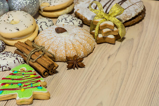 istock Gingerbread cookies with different shapes, cinnamon sticks and star anise 615905294