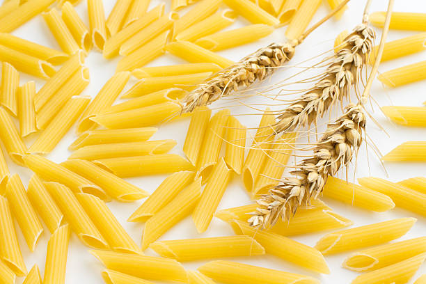 istock Pasta and three spikelets of wheat 615905966