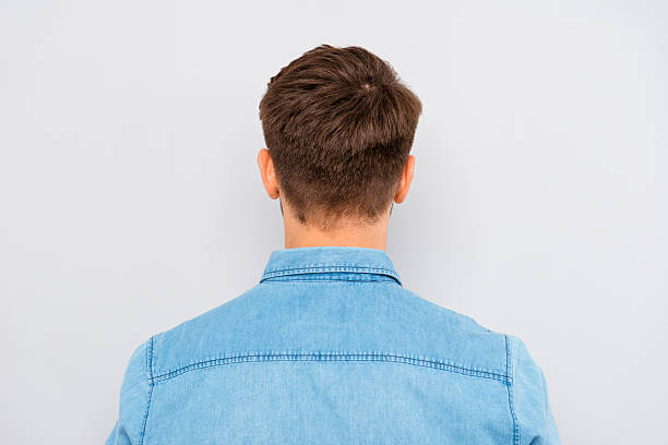 istock Back view of young man isolated on gray background 615906014